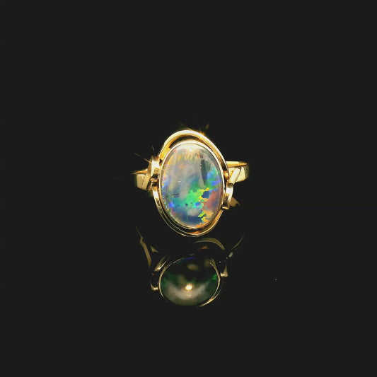 Oval Opal Ring with Swirl Gold Halo