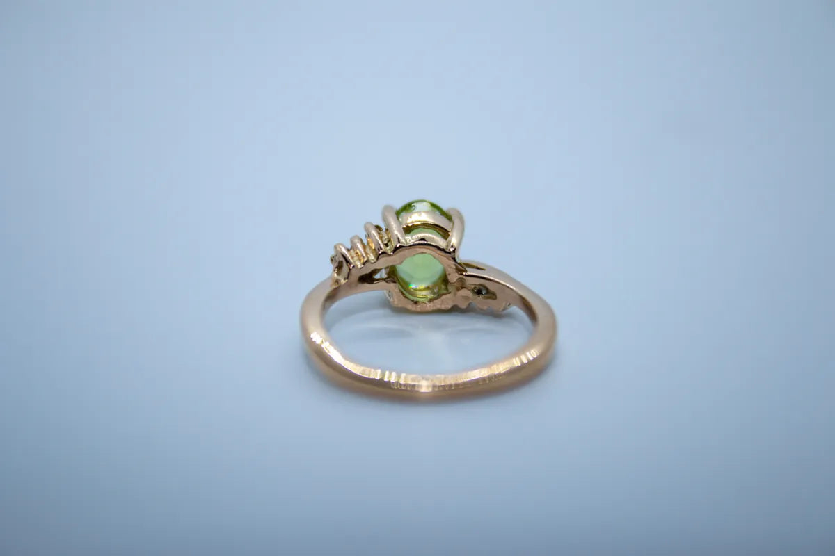 14 K Y/G Peridot and Diamond Ring