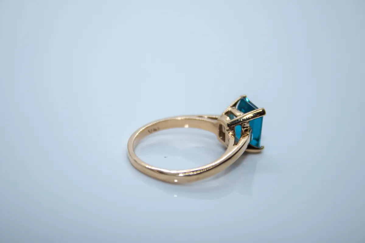 14 K Yellow Gold Blue Topaz Emerald Cut Ring